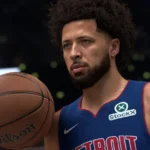 Basketball player in a blue Detroit jersey holds a Wilson basketball, StockX logo visible, blurred background.