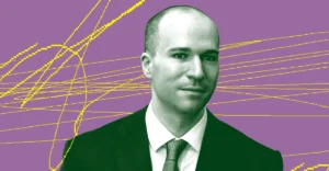 Man in a suit with a tie against a purple background with yellow abstract lines.