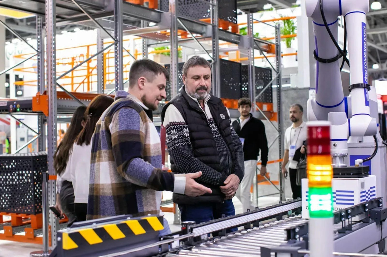 warehouse robotics system at Maven Robotics handling boxed goods in a facility