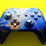 Colorful gaming controller with a world map design on a bright yellow background.