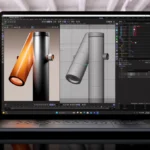 Laptop displaying 3D modeling software with two cylindrical objects, one textured and one wireframe, in a modern office se...