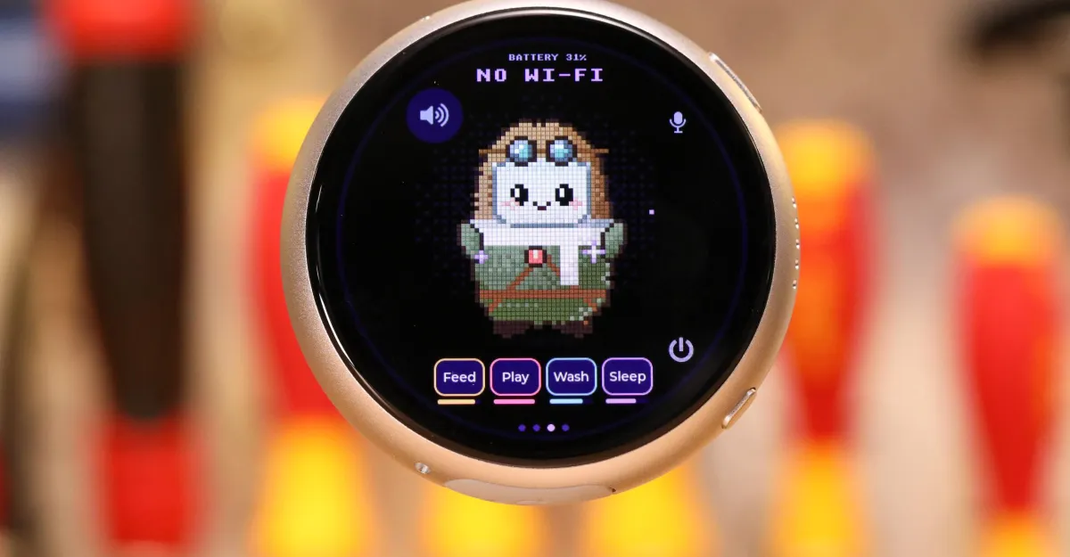 Round device screen displaying pixel art character, battery at 31%, no Wi-Fi, with buttons labeled feed, play, wash, sleep.