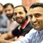 AI scam defense bot on a phone screen used to waste fraudsters' time