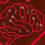 Circuit board pattern resembling a brain with pink pathways and small holes on a dark background