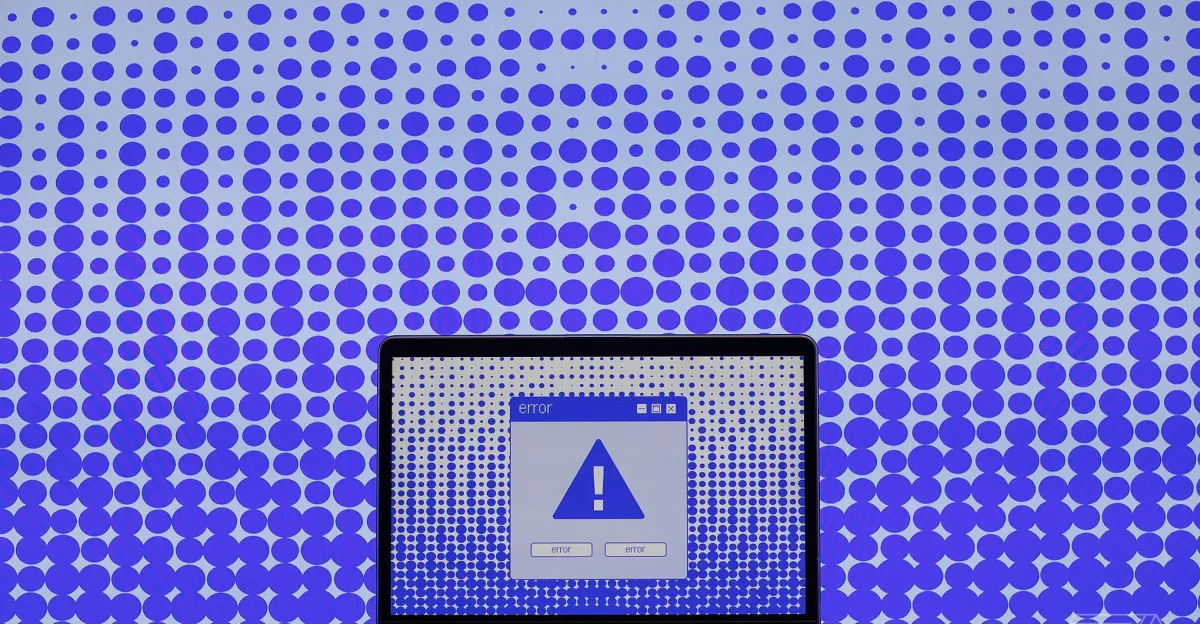 Laptop screen showing a large error alert icon, set against a background of blue dots on a gradient backdrop.