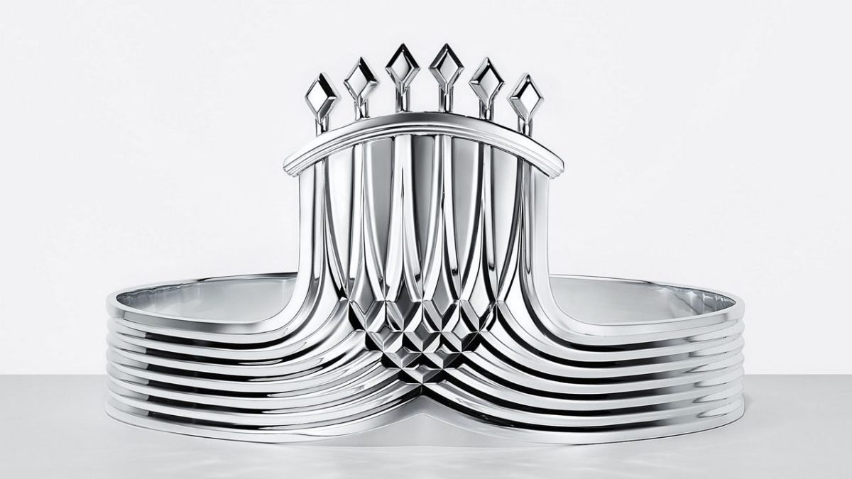 Sleek silver trophy with intricate geometric design and vertical diamond-shaped elements on a white background