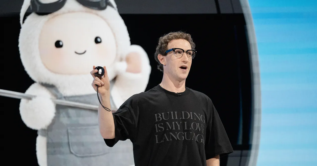 Man in black shirt holding a device speaks on stage, large cartoon figure in background, shirt text reads "building is my...
