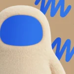Furry beige figure with a blue face against a tan background with blue "M" patterns.