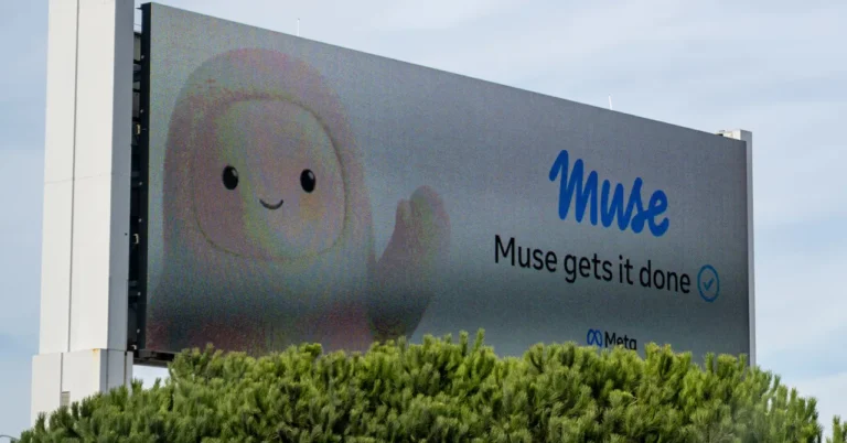 Billboard with cartoon character and text "Muse gets it done" above trees, featuring Meta logo.
