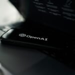 OpenAI funding report on a laptop screen with valuation figures and investor notes