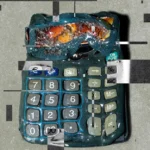 Distorted calculator with glitch effects and overlaying digital patterns