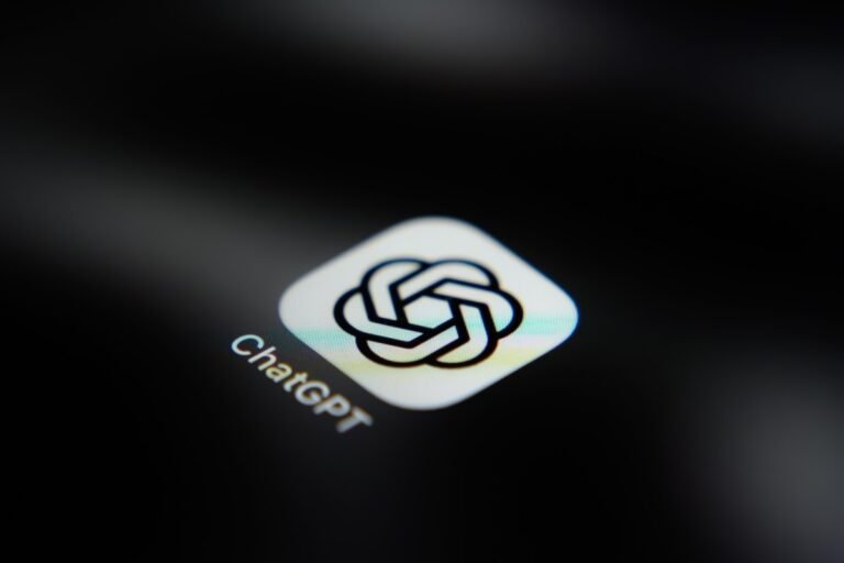 ChatGPT app icon on a dark screen, displaying a logo with interlocking shapes and text "ChatGPT" below.