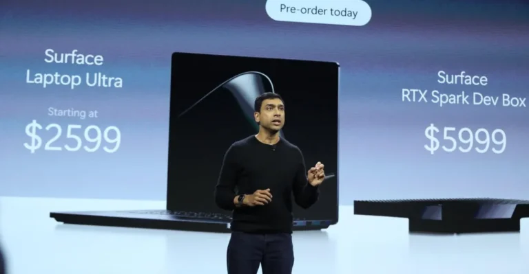 Person presenting on stage with Surface Laptop Ultra and RTX Spark Dev Box prices displayed; pre-order message above.