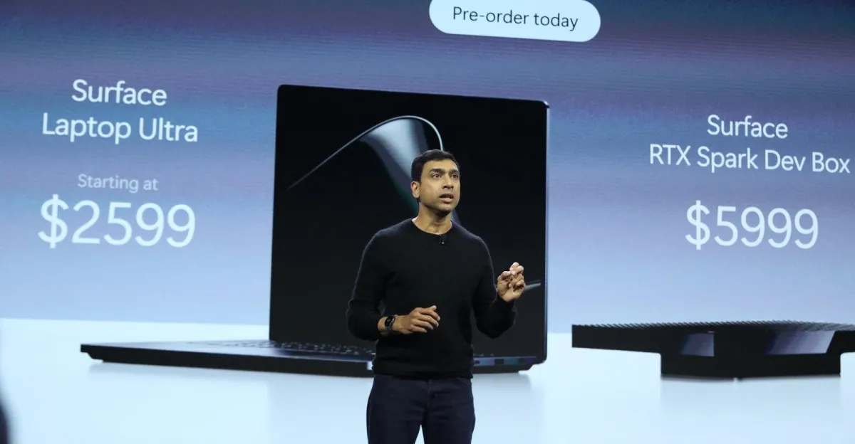 Person presenting on stage with Surface Laptop Ultra and RTX Spark Dev Box prices displayed; pre-order message above.